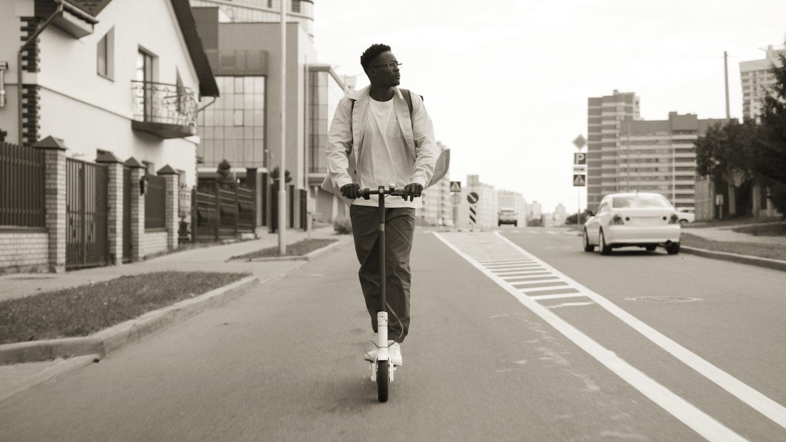 A rider on an electric scooter on a city street