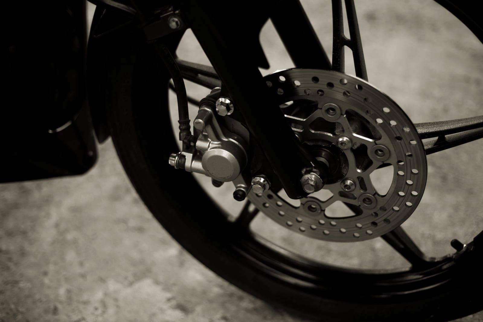 A close-up of a disc brake on a wheel