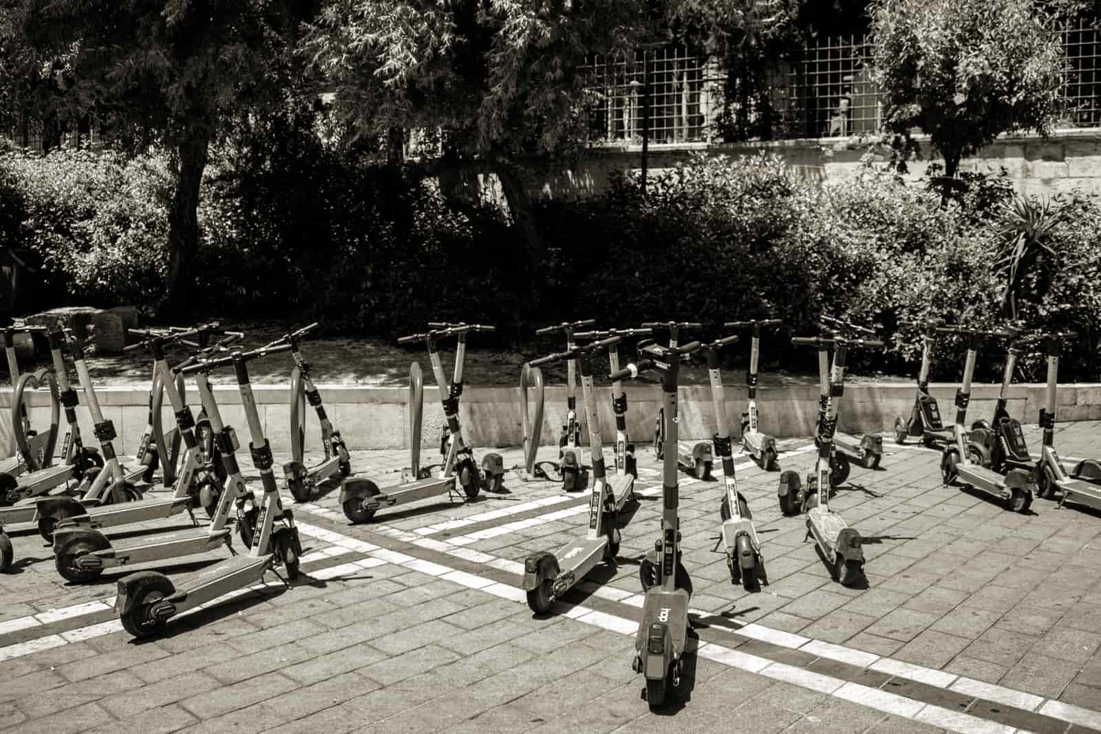 A row of parked electric scooters