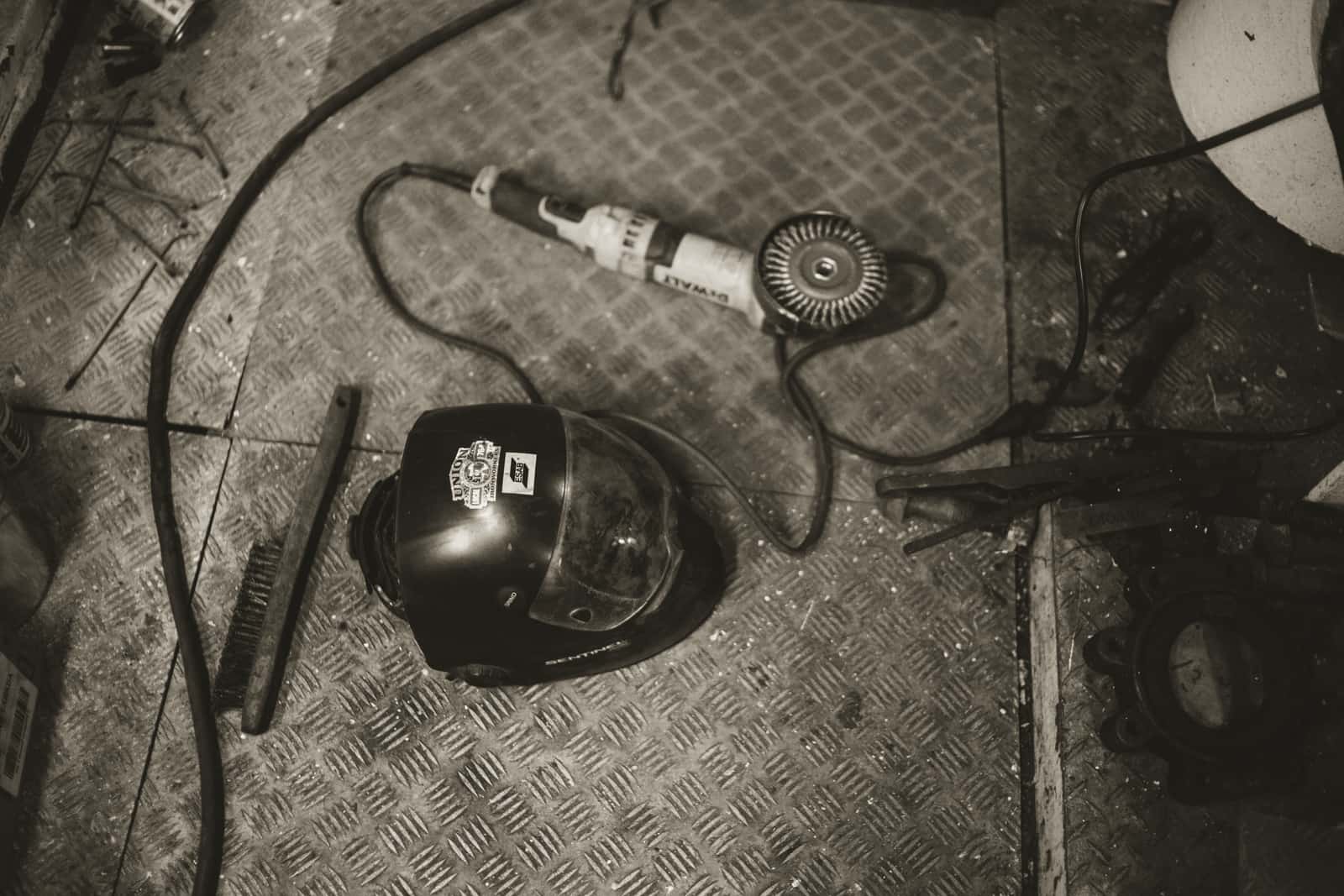 A helmet and protective gloves laid out on a surface