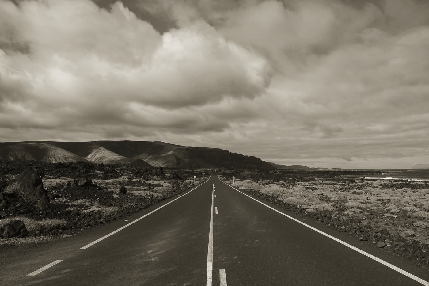 An open stretch of road running into open country