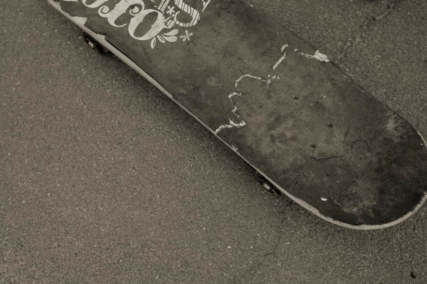 A skateboard resting on a paved surface