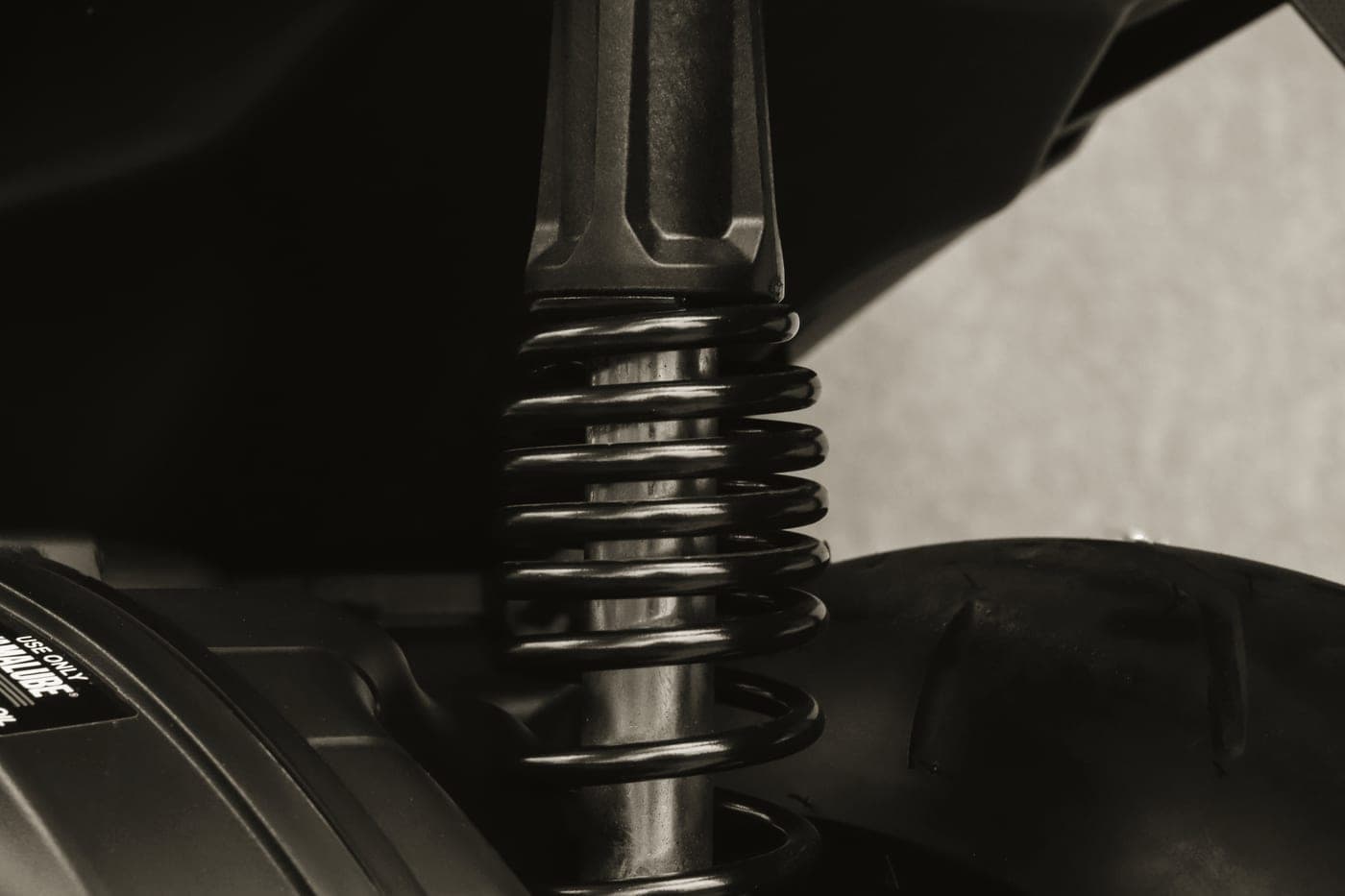 A close-up of a coil spring shock absorber